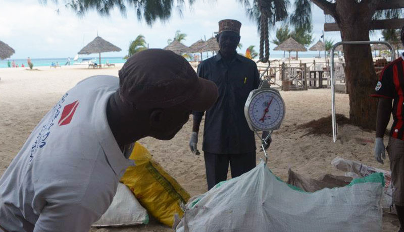 Weighing the rubbish collected as it arrived before sorting