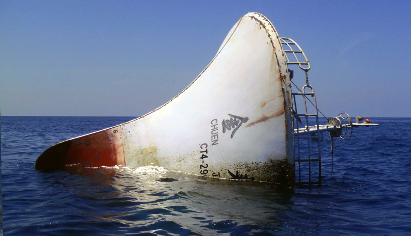 Scuba Do Zanzibar investigating the sunken longliner vessel image of bow floating just above the surface of the ocean